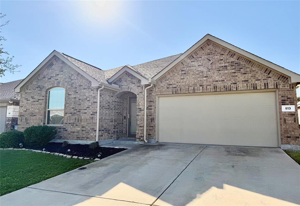 813 Evergreen Street Princeton, TX 75407 - Photo 3 of 29 a view of a house with brick walls
