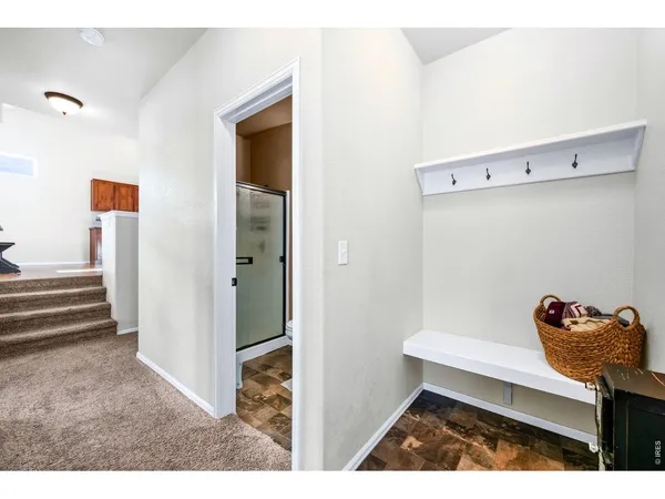 a view of hallway with seating area