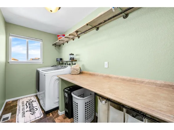 a bedroom with a bed and a table