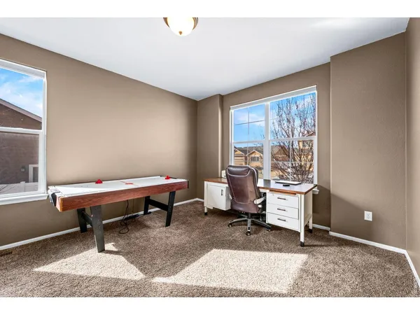 a bedroom with furniture and a window