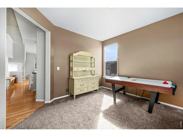 a room with furniture and view of wooden floor