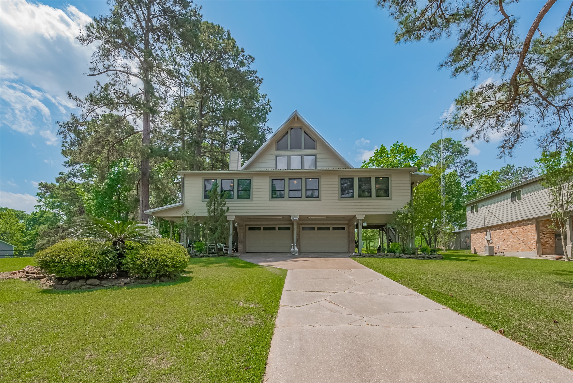780 Hickory Ridge Drive Coldspring, TX 77331 - Photo 2 of 50 a front view of a house with a yard