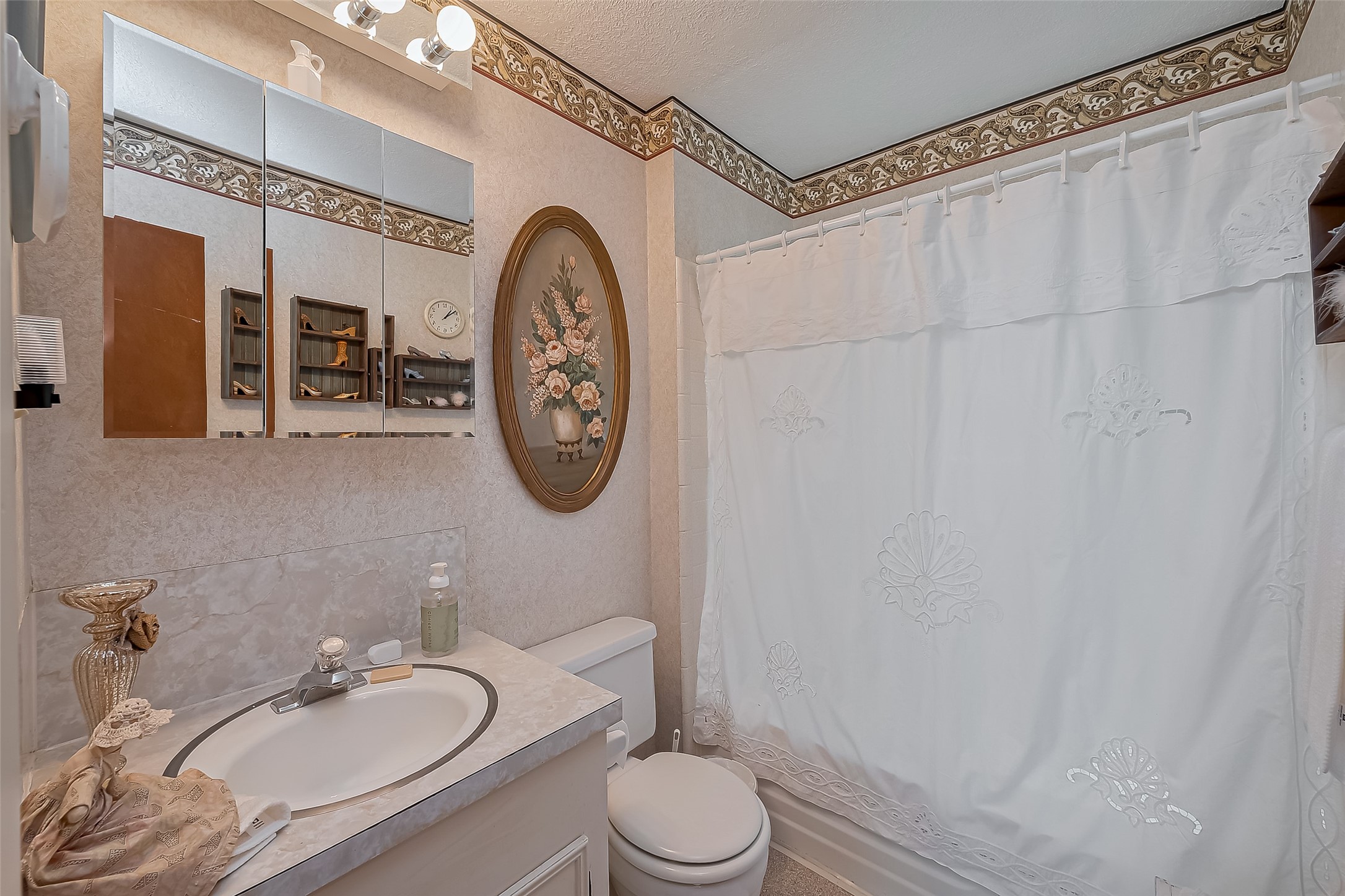 780 Hickory Ridge Drive Coldspring, TX 77331 - Photo 21 of 50 a bathroom with a granite countertop sink mirror vanity and toilet