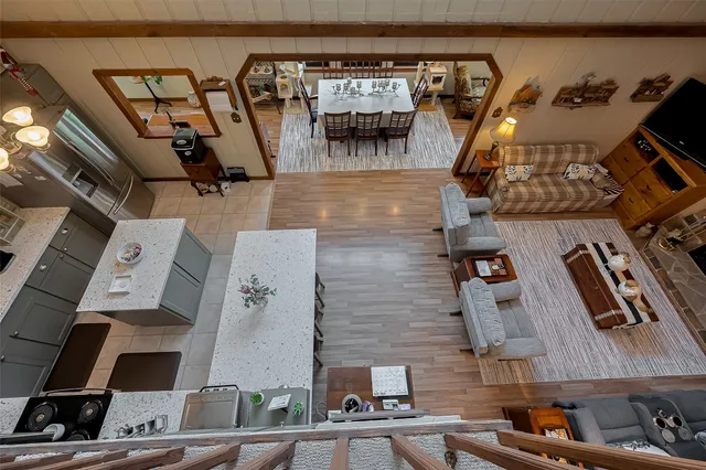 a view of a chairs and tables in the back yard