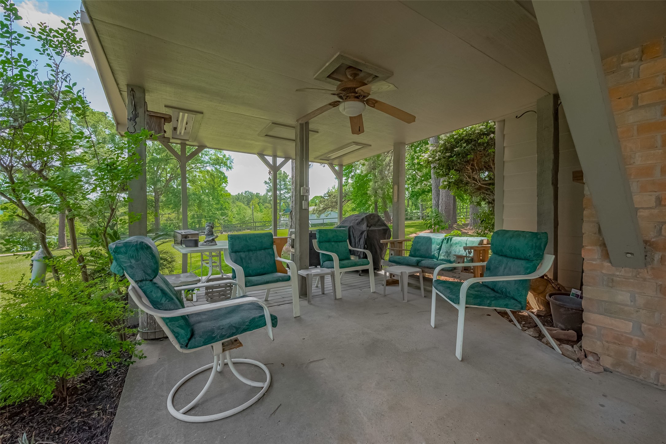 780 Hickory Ridge Drive Coldspring, TX 77331 - Photo 41 of 50 a view of a chairs and tables in the back yard