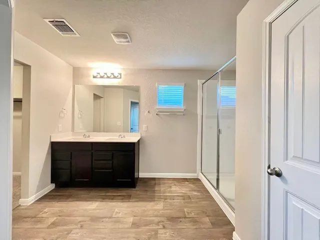 a view of a kitchen with microwave and cabinets