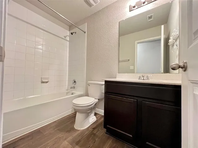 a bathroom with a double vanity sink and mirror
