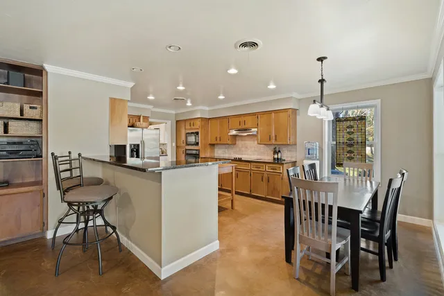 a view of a dining room with furniture