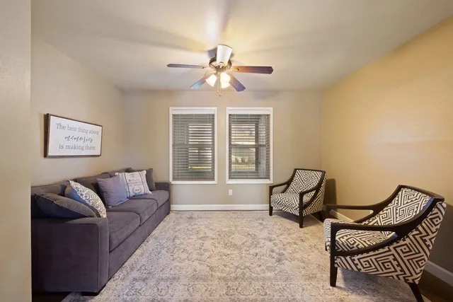 a living room with furniture and a window