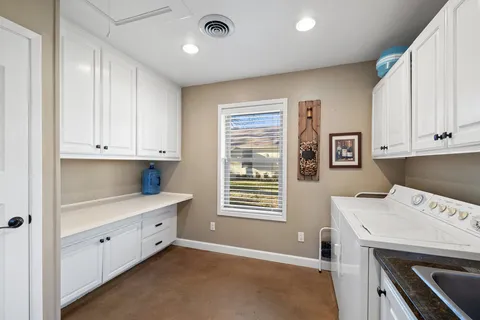 a room with a stove and a refrigerator