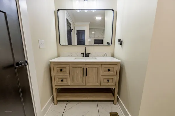 a bathroom with a sink and a mirror