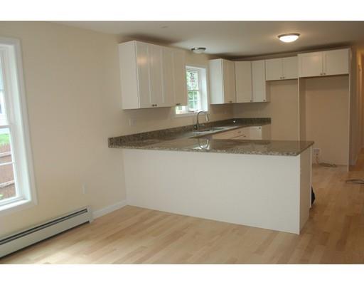 230 Maple Street Winchendon, MA 01475 - Photo 16 of 21 a kitchen with a sink cabinets and a window