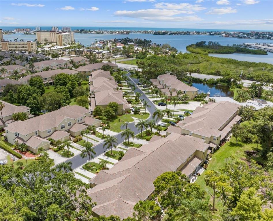 11235 Kapok Grand Circle Madeira Beach, FL 33708 - Photo 2 of 34 an aerial view of residential houses with outdoor space