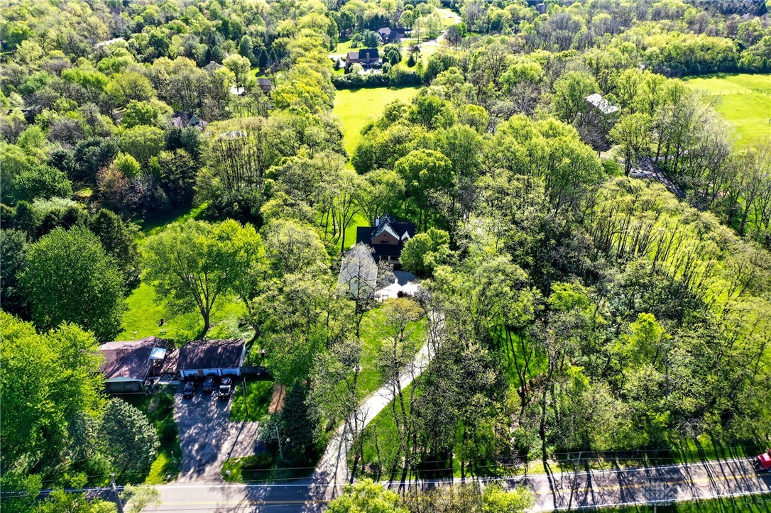 330 South Alpha Bellbrook Road Bellbrook, OH 45305 - Photo 69 of 87 Perched on an expansive lot, this secluded residence offers unparalleled privacy amidst lush greenery.