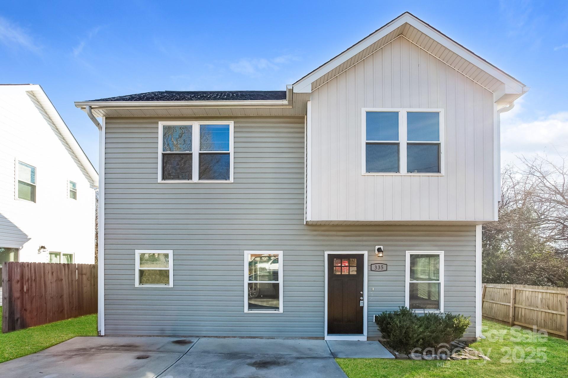 335 Todd Road Charlotte, NC 28208 - Photo 1 of 15 a front view of a house with garden