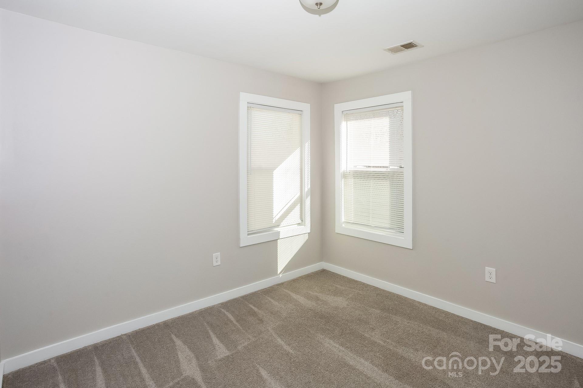 335 Todd Road Charlotte, NC 28208 - Photo 11 of 15 an empty room with windows
