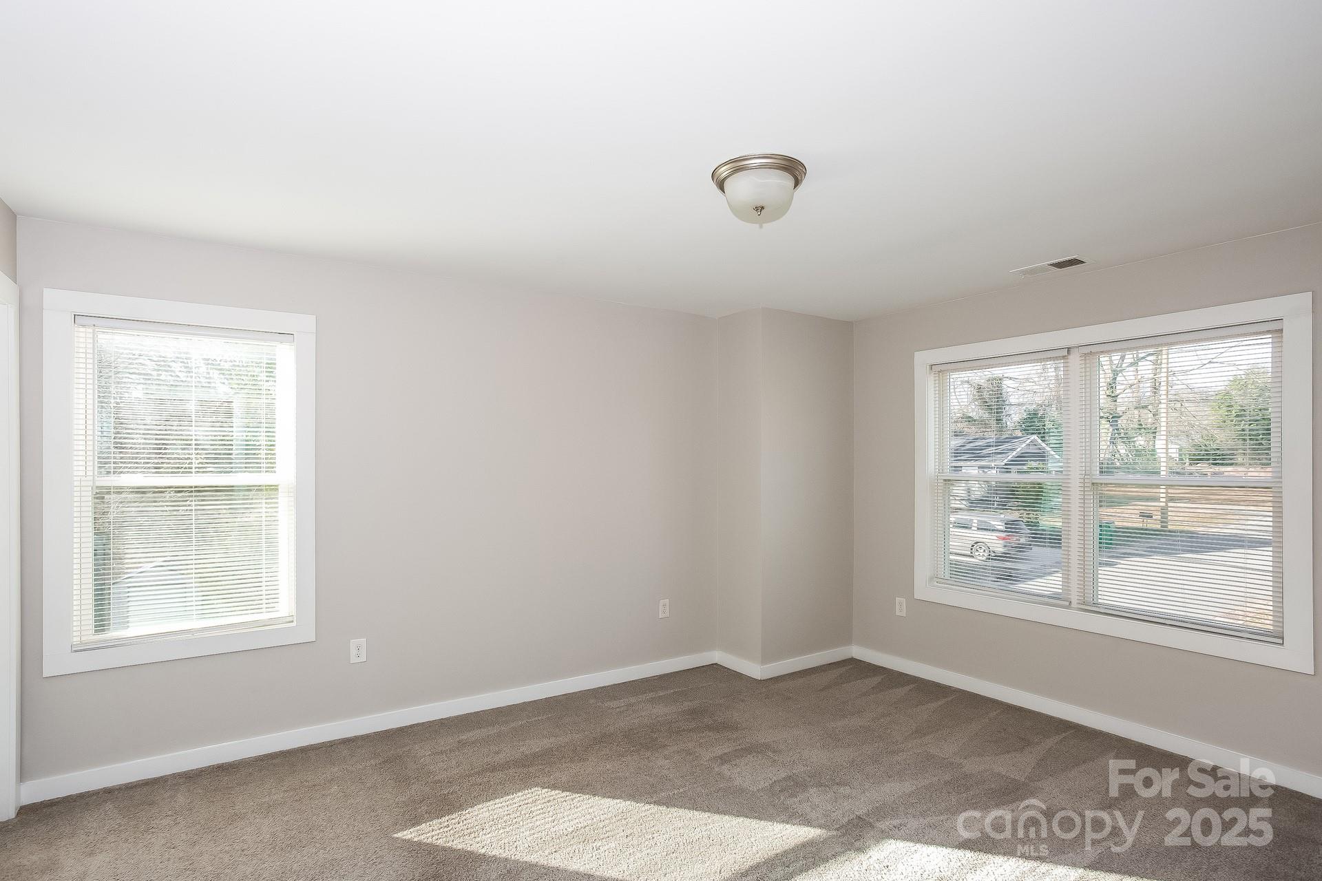 335 Todd Road Charlotte, NC 28208 - Photo 6 of 15 an empty room with windows