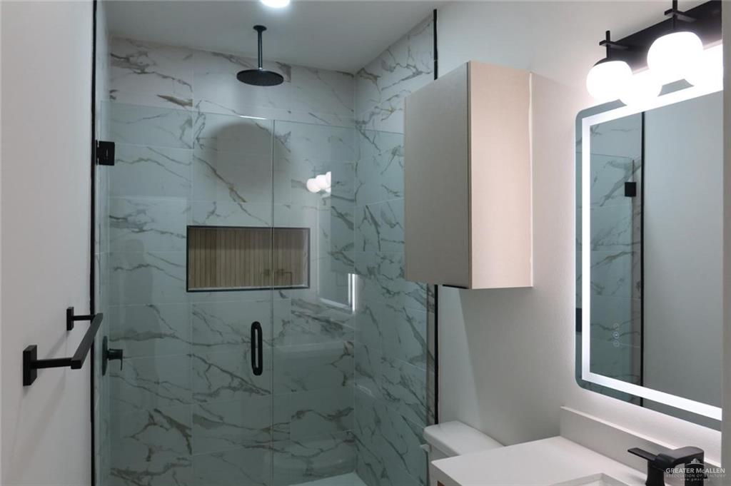 2905 Estevan Street, Unit 2 Mission, TX 78574 - Photo 4 of 11 a bathroom with a toilet a sink and shower