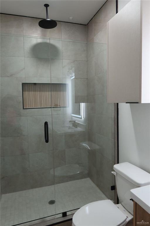2905 Estevan Street, Unit 2 Mission, TX 78574 - Photo 8 of 11 a bathroom with a toilet a sink and shower