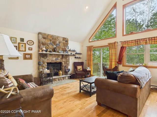 a view of a dining room with furniture and a rug