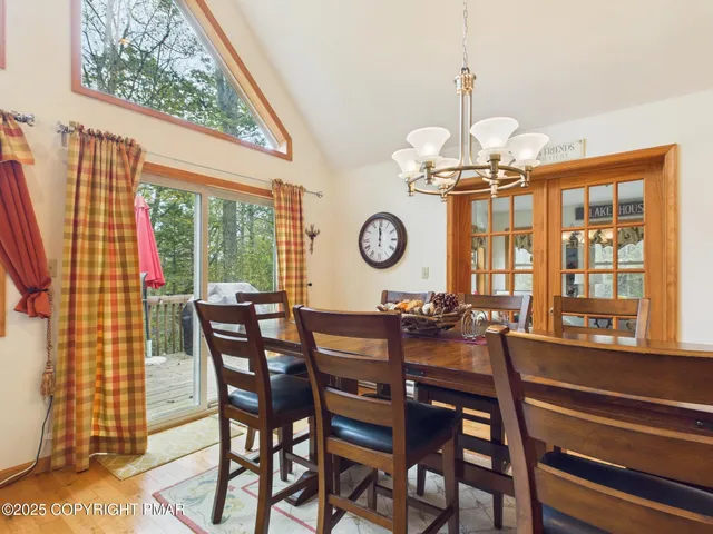 a bathroom with a sink a toilet a mirror and shower