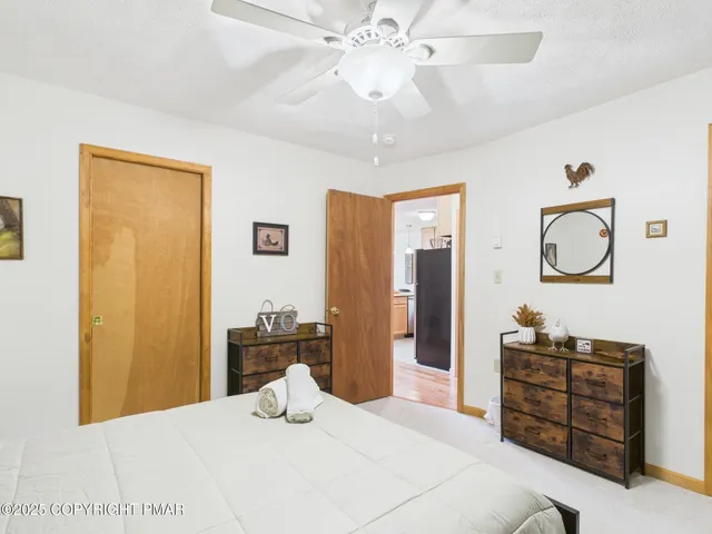 a bathroom with a sink a toilet and shower curtain