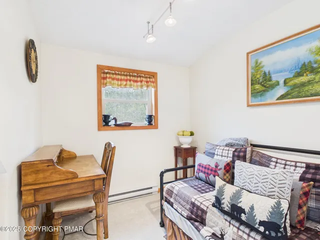 a room with furniture a rug and a window