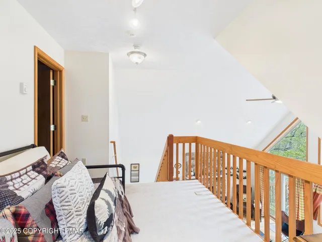 a living room with a table and a flat screen tv