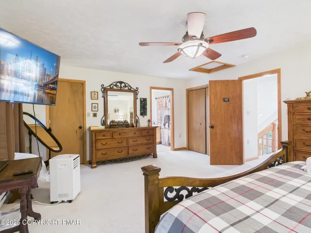 a bathroom with a shower a toilet and a shower