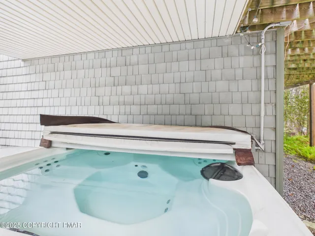 a kitchen with a sink a counter and chairs
