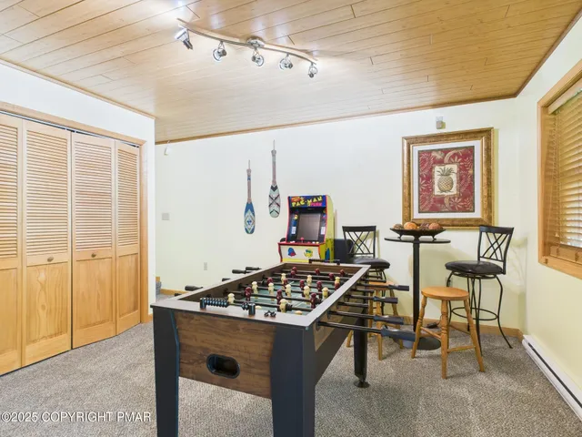 a view of staircase with a table and chairs