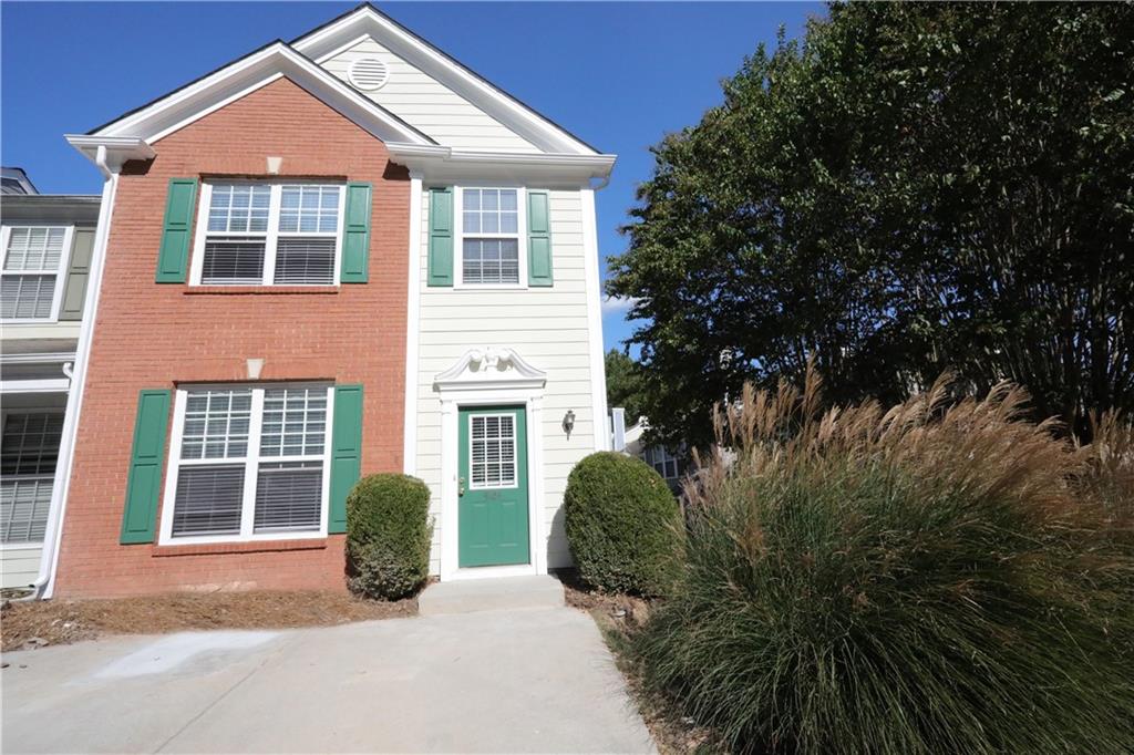 4124 Howell Park Road Duluth, GA 30096 - Photo 1 of 1 a front view of a house with a garden and plants