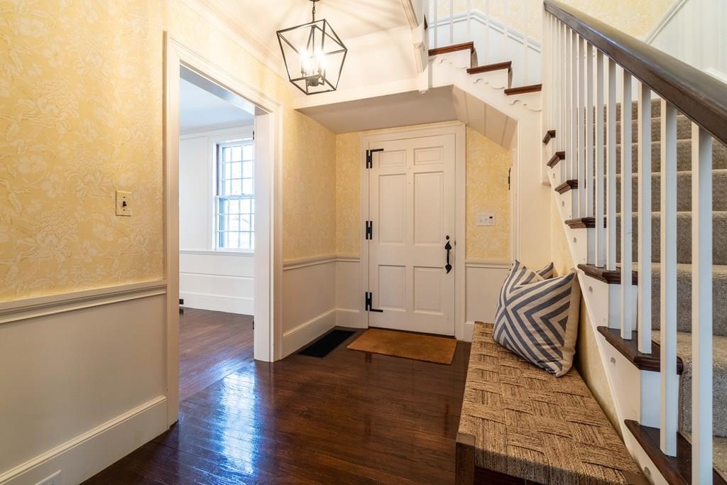 43 Burditt Avenue Hingham, MA 02043 - Photo 23 of 41 a view of a hallway with wooden floor and staircase