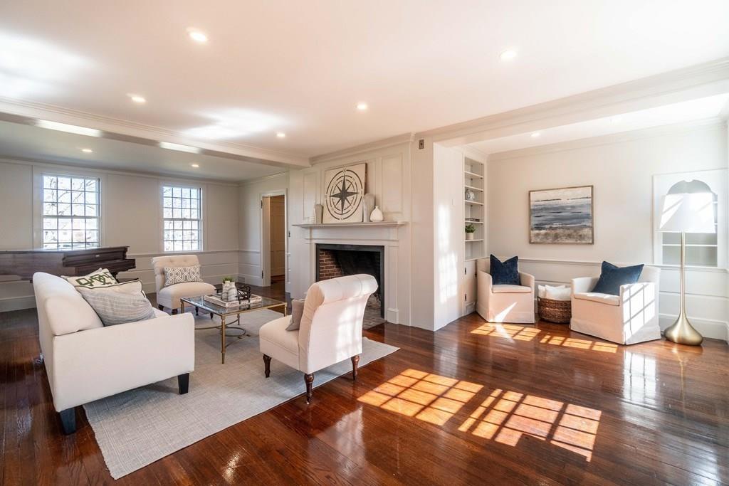 43 Burditt Avenue Hingham, MA 02043 - Photo 24 of 41 a living room with furniture or couch and a fireplace