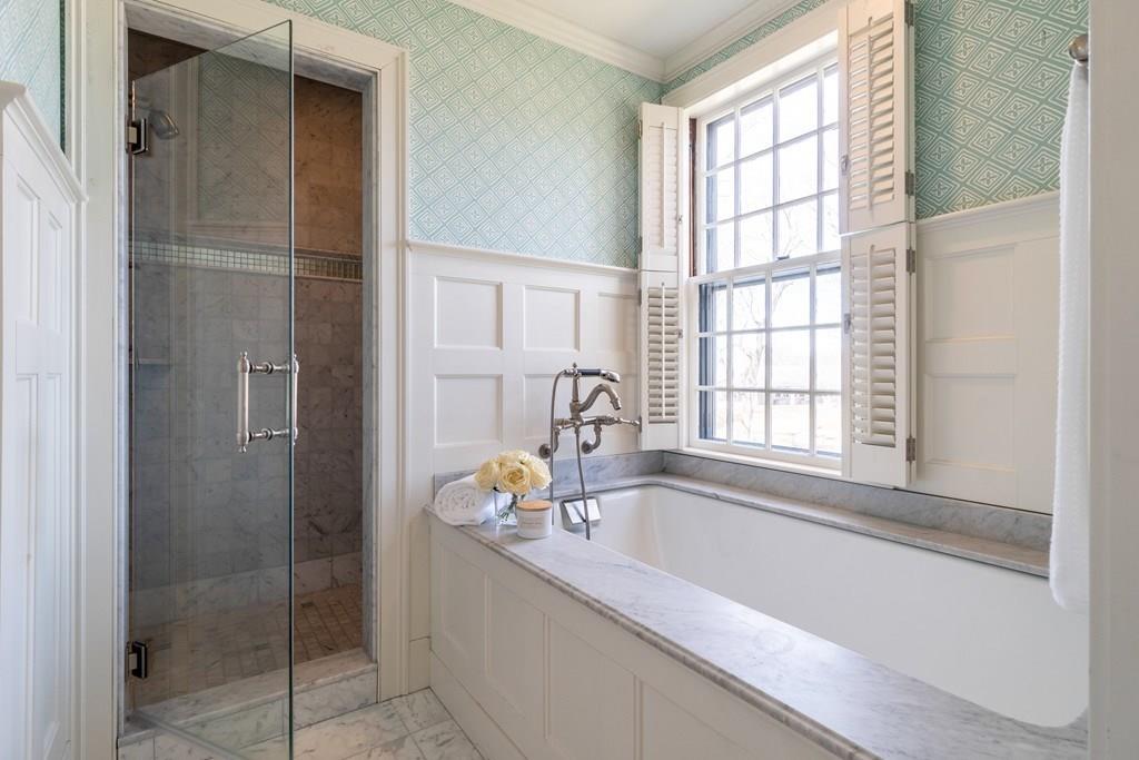 43 Burditt Avenue Hingham, MA 02043 - Photo 32 of 41 a bathroom with a tub and a window