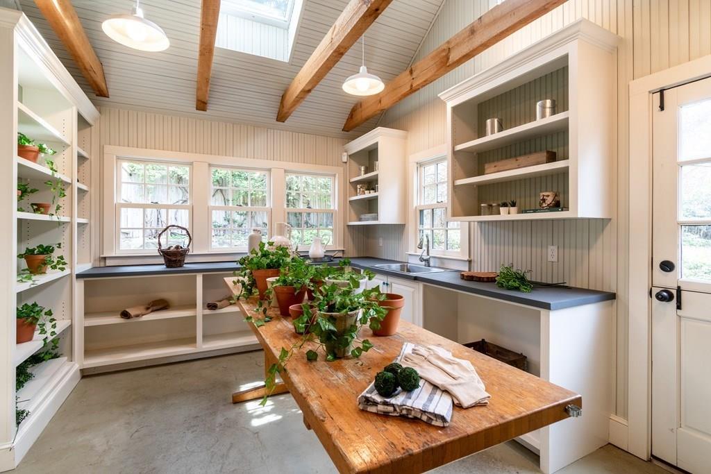 43 Burditt Avenue Hingham, MA 02043 - Photo 37 of 41 a living room with furniture a rug kitchen view and large windows