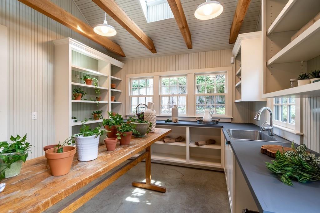 43 Burditt Avenue Hingham, MA 02043 - Photo 38 of 41 a kitchen with a large window and potted plant