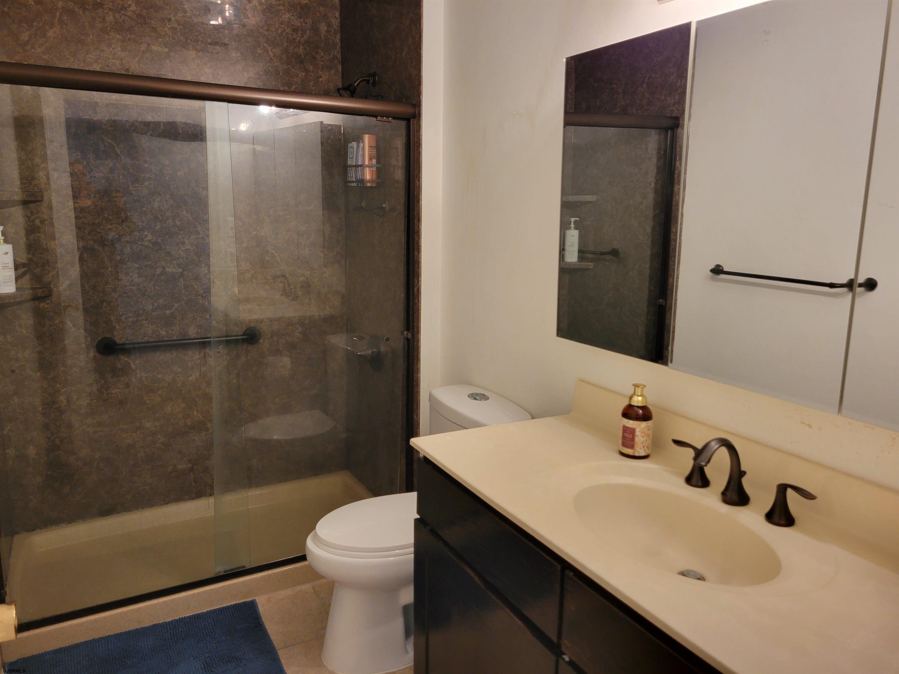 21 Sugarberry Road Egg Harbor Township, NJ 08234 - Photo 31 of 59 a bathroom with a sink toilet and shower