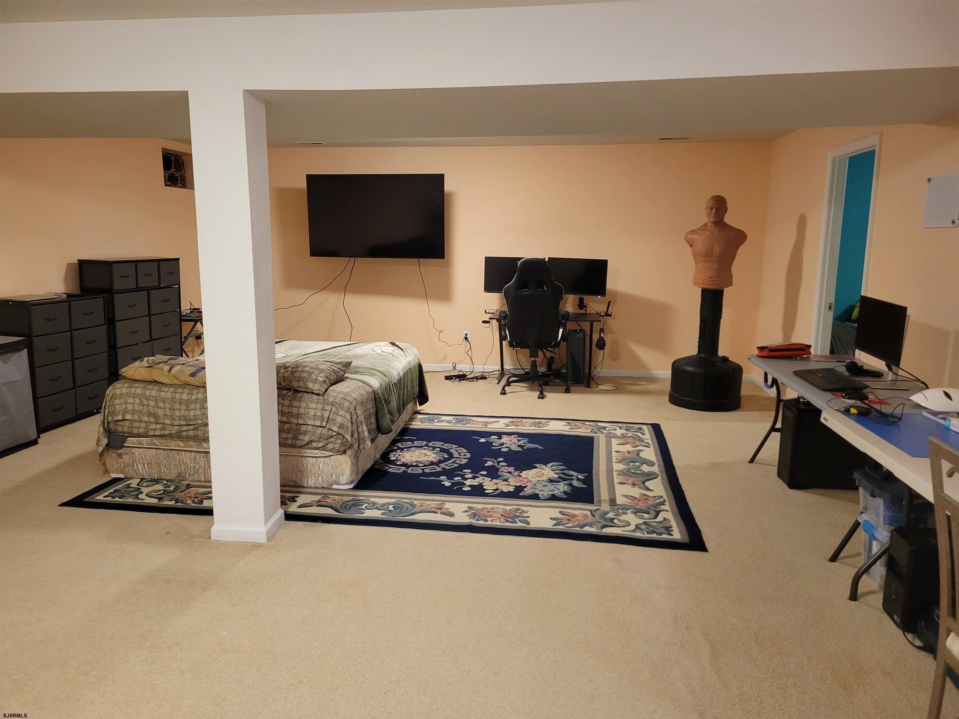 21 Sugarberry Road Egg Harbor Township, NJ 08234 - Photo 35 of 59 a living room with fireplace furniture and a flat screen tv