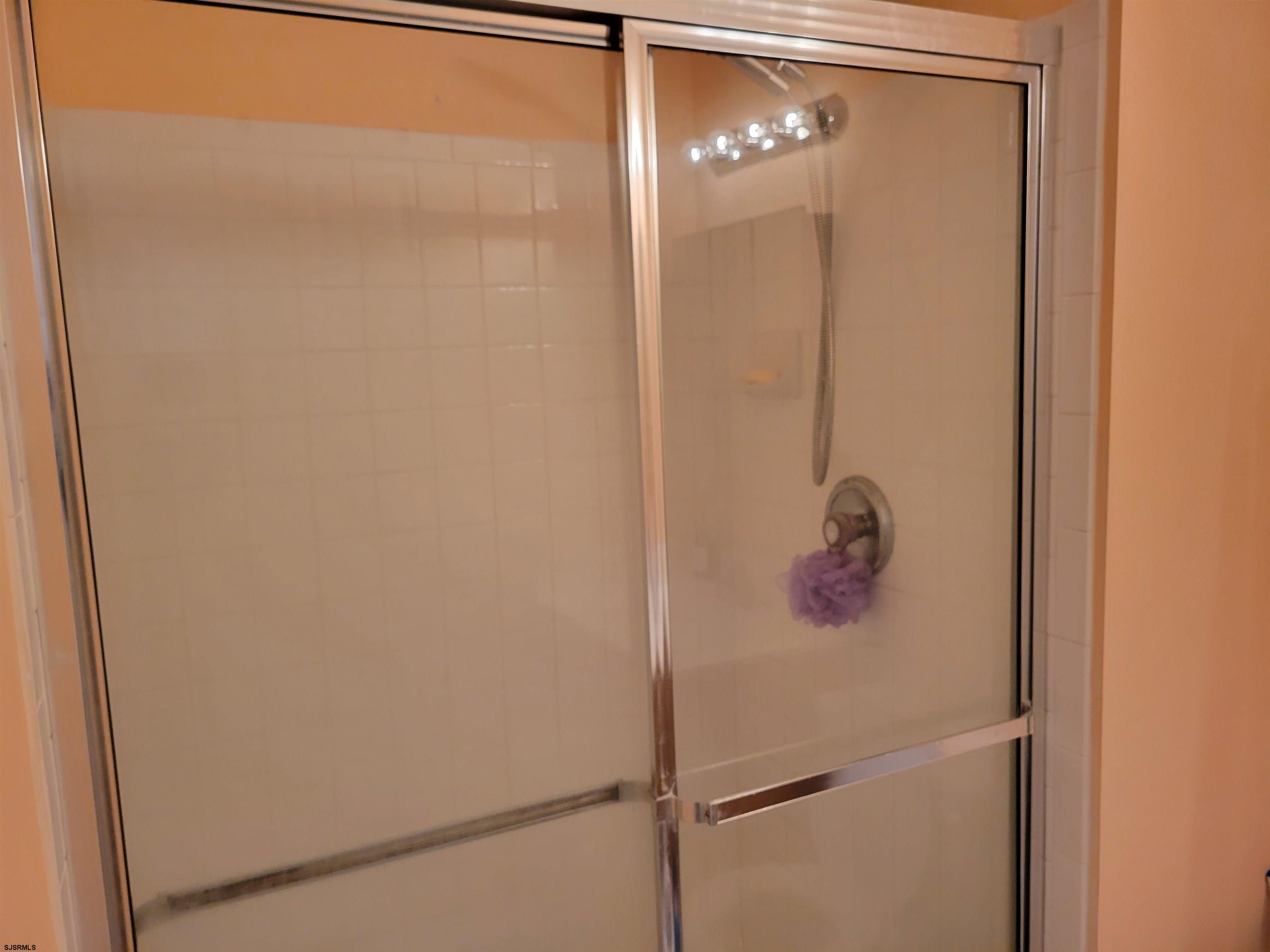 21 Sugarberry Road Egg Harbor Township, NJ 08234 - Photo 37 of 59 a bathroom with a glass shower door