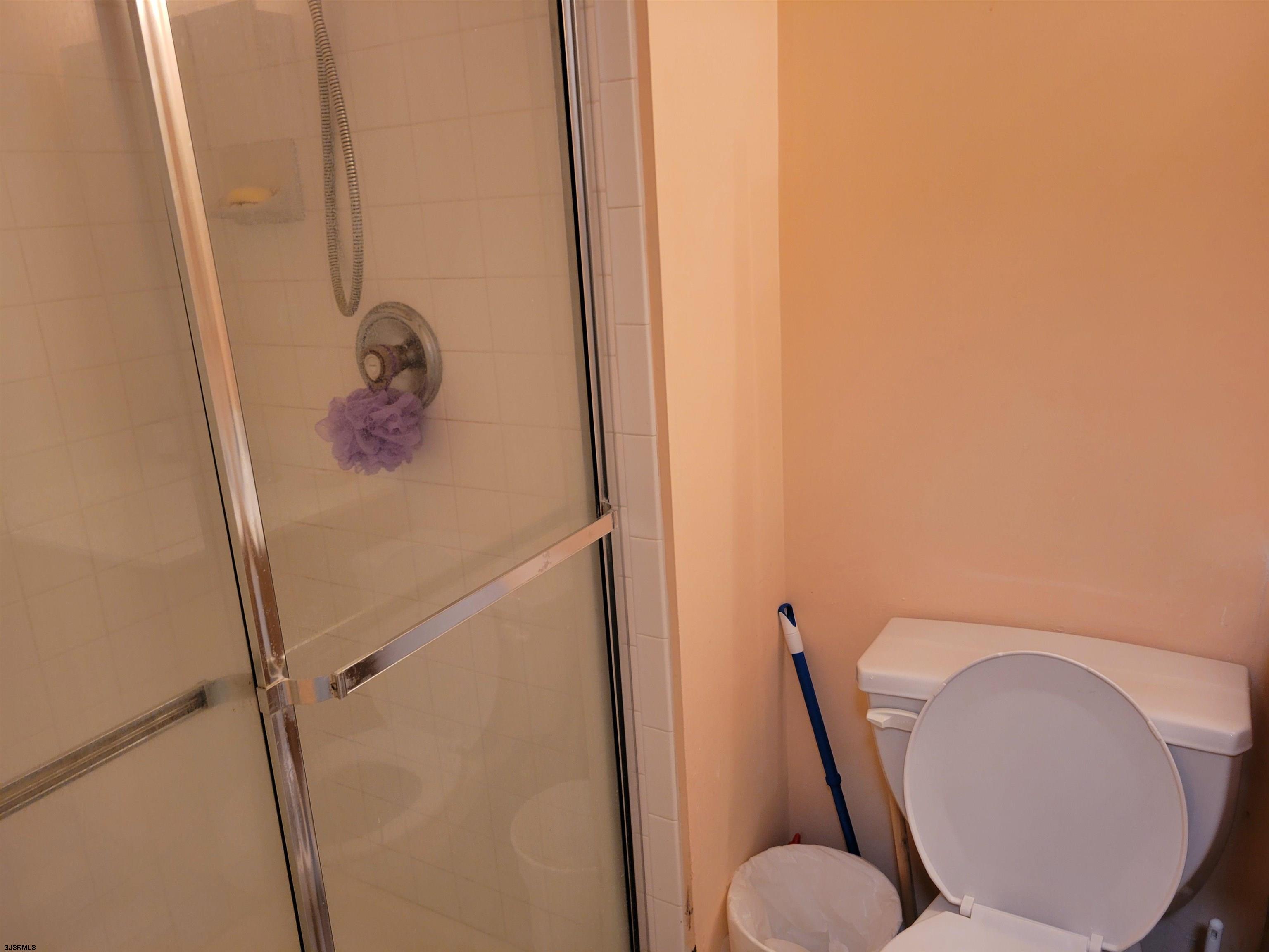 21 Sugarberry Road Egg Harbor Township, NJ 08234 - Photo 39 of 59 a bathroom with a toilet and a mirror