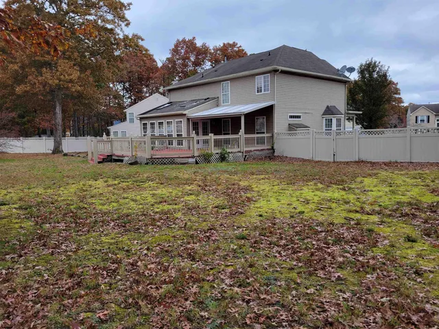 a big yard with lots of green space and plants