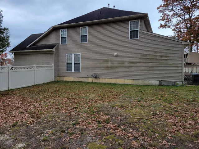 a couple of cars parked in front of a building