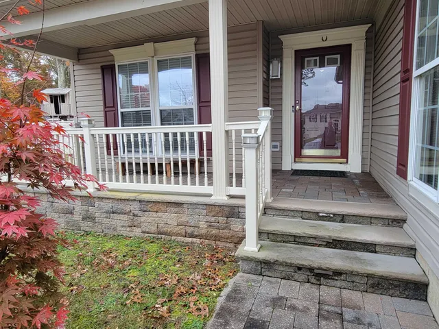 a view of porch with a bench