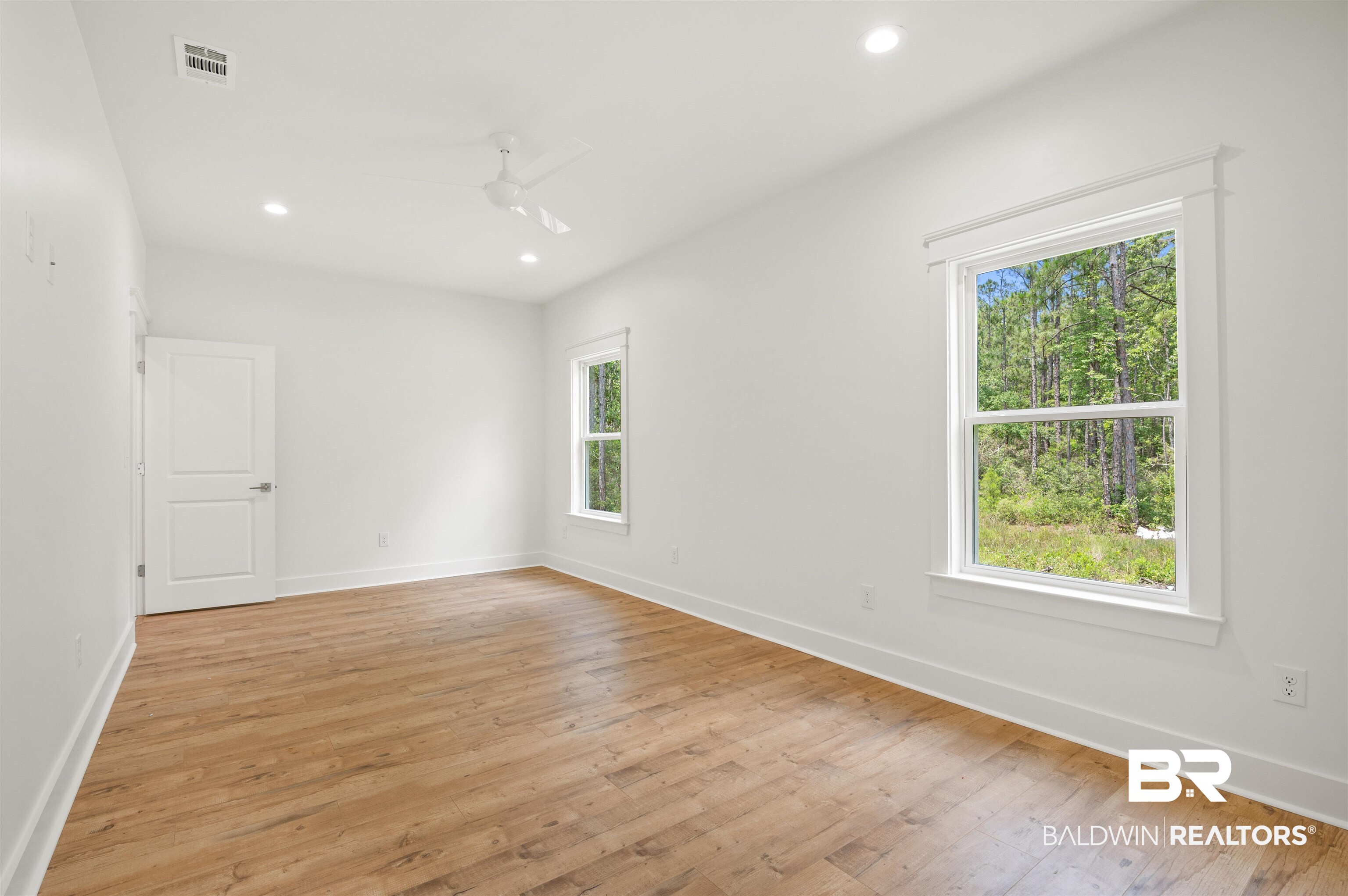 657 Island Way Gulf Shores, AL 36542 - Photo 15 of 59 Unfurnished room with light wood-style floors, baseboards, recessed lighting, and a ceiling fan