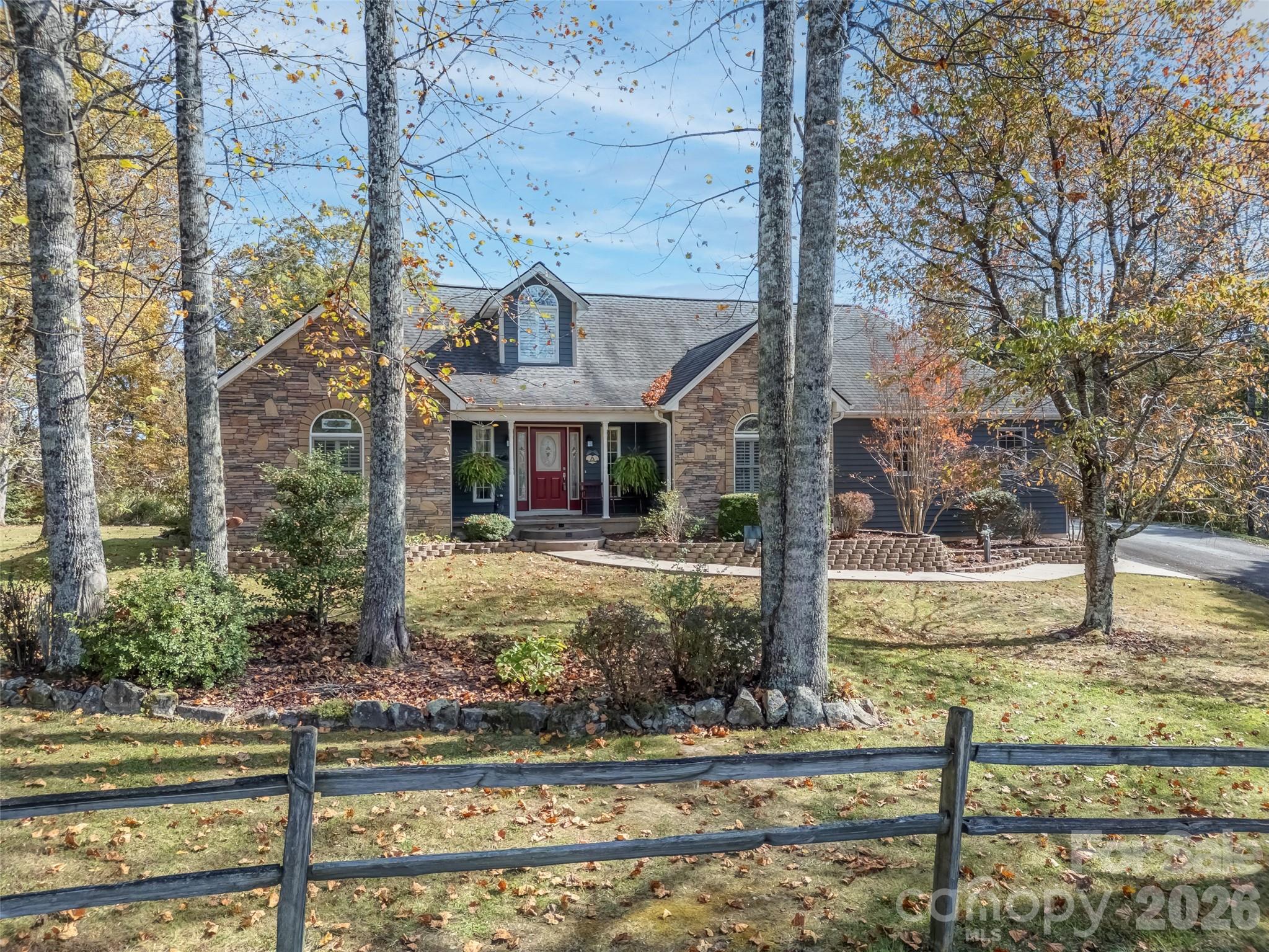 1340 Macedonia Road Saluda, NC 28773 - Photo 2 of 45 a front view of a house with garden