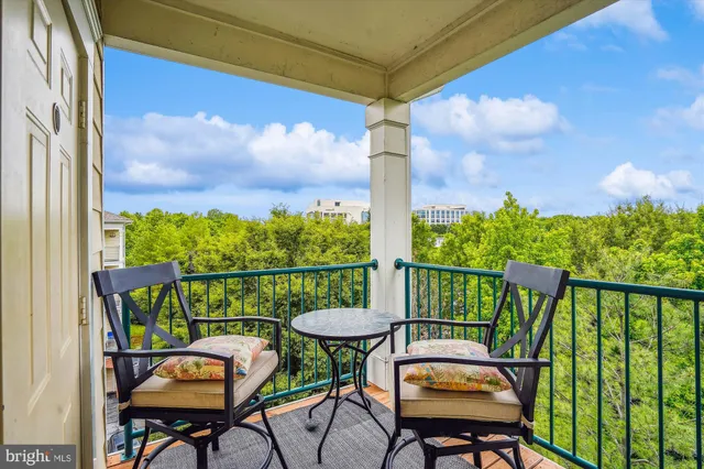 a view of a balcony with furniture