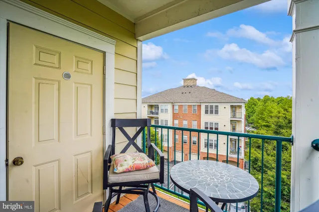 a view of a balcony with furniture