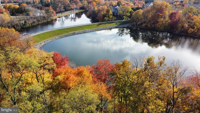 a view of a lake with a house in the background
