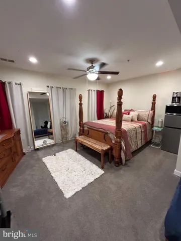 a bedroom with furniture and a window